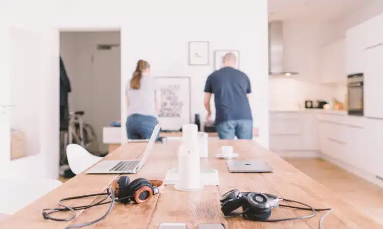 orange and black headphones on table